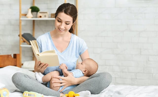 Mother Reading Book to Kid