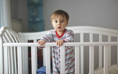 Toddler in crib